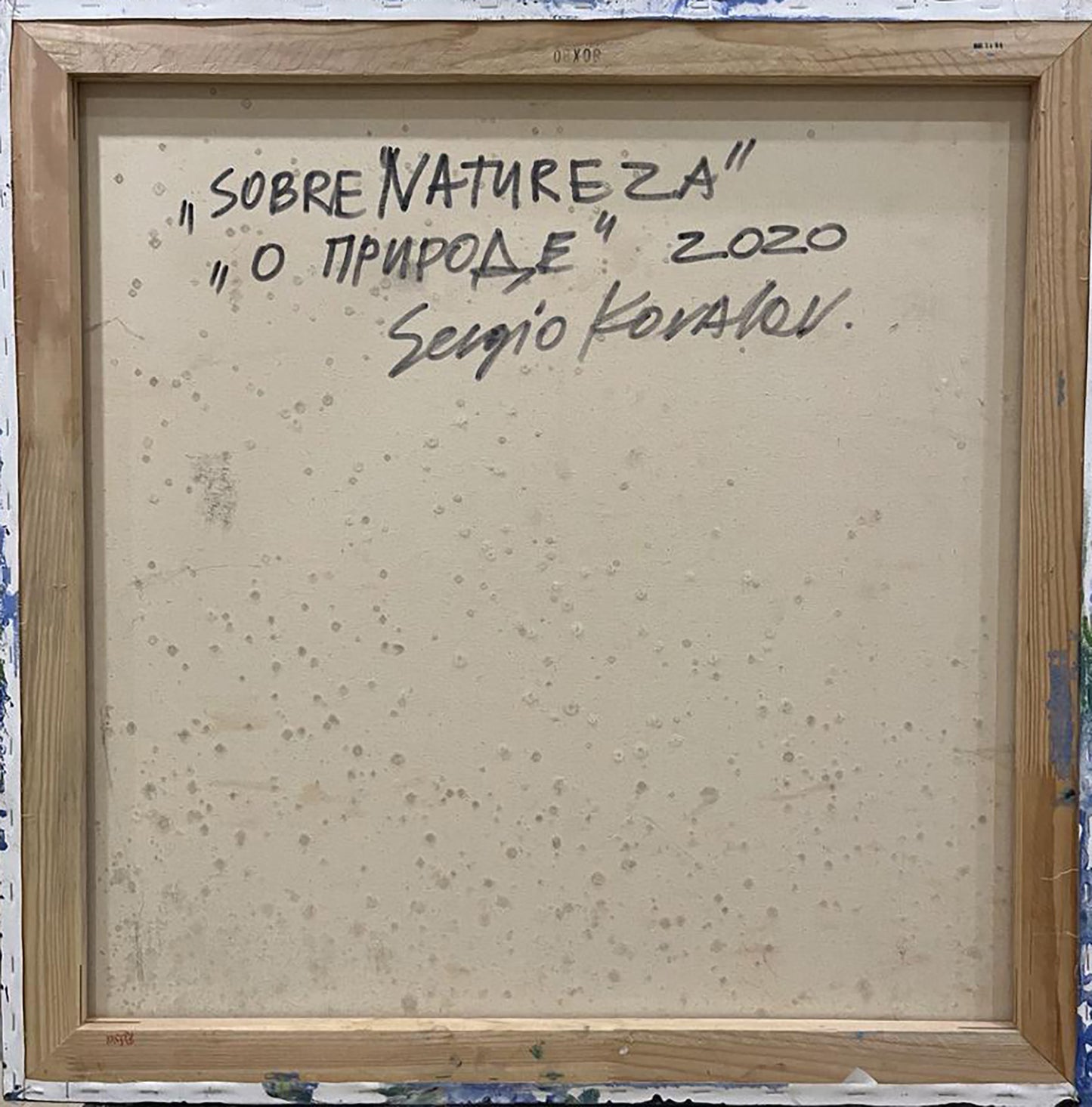 Back of Sobre Natureza oil painting by Serhiy Kovalev with handwritten text and wood frame