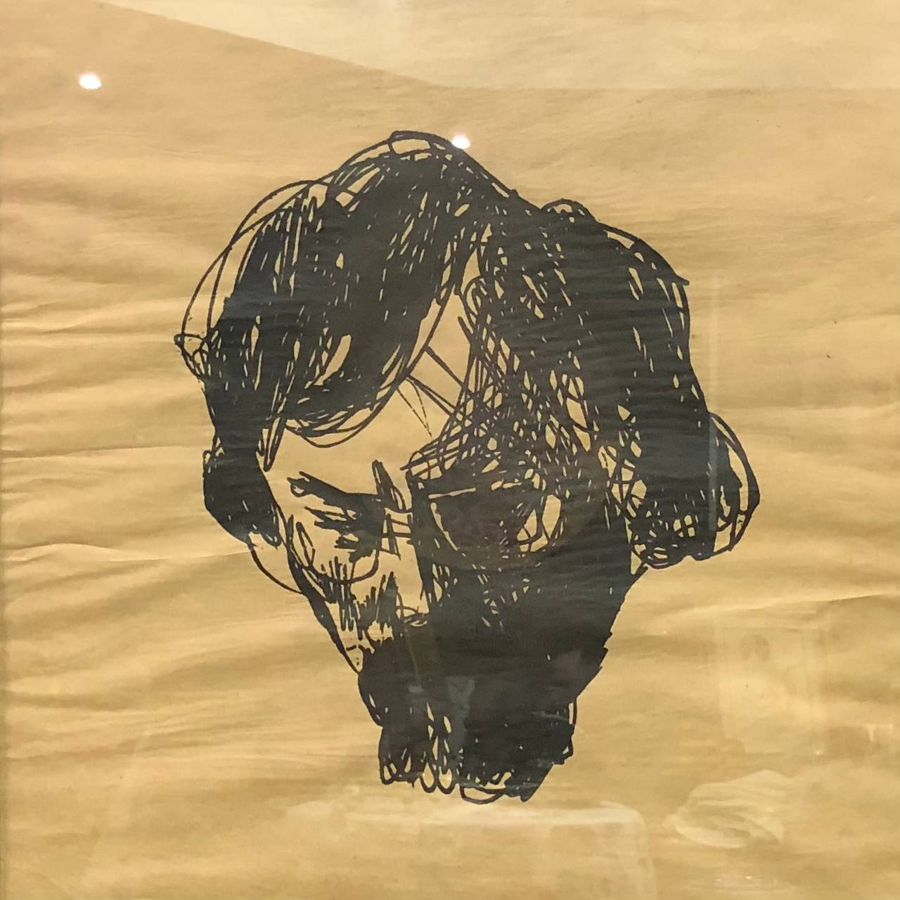 Black scribbled skull sketch with tangled hair and beard by Georgii Yakutovych