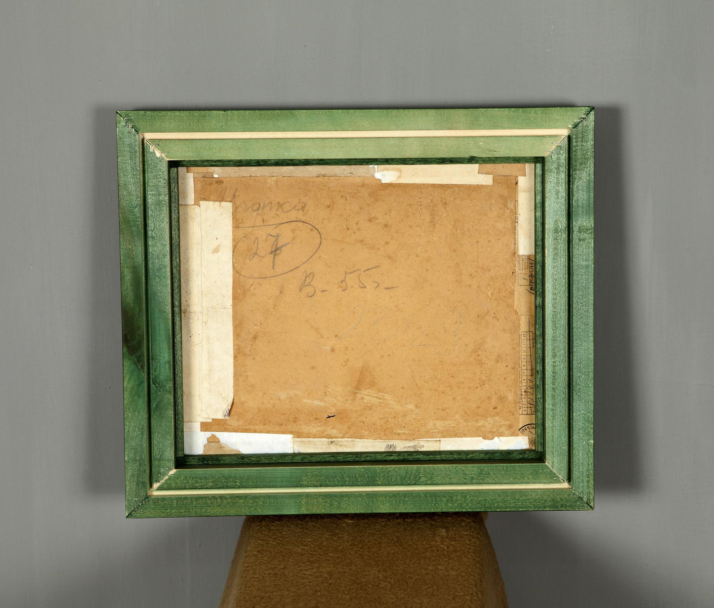 Back of green distressed wooden frame for Soviet artist Zyupka I original painting