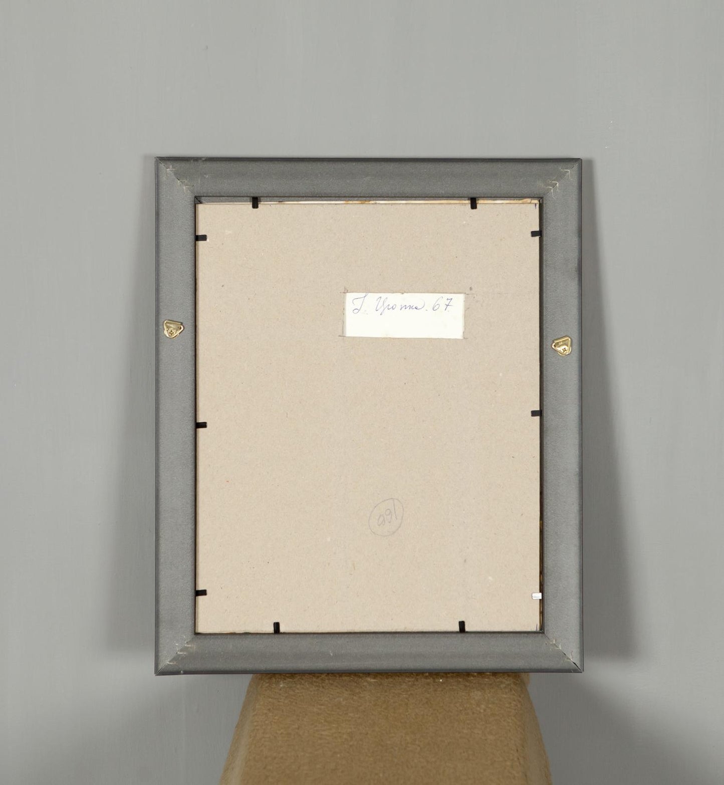 Back of gray matte rectangular frame with gold hardware for Autumn Landscape painting