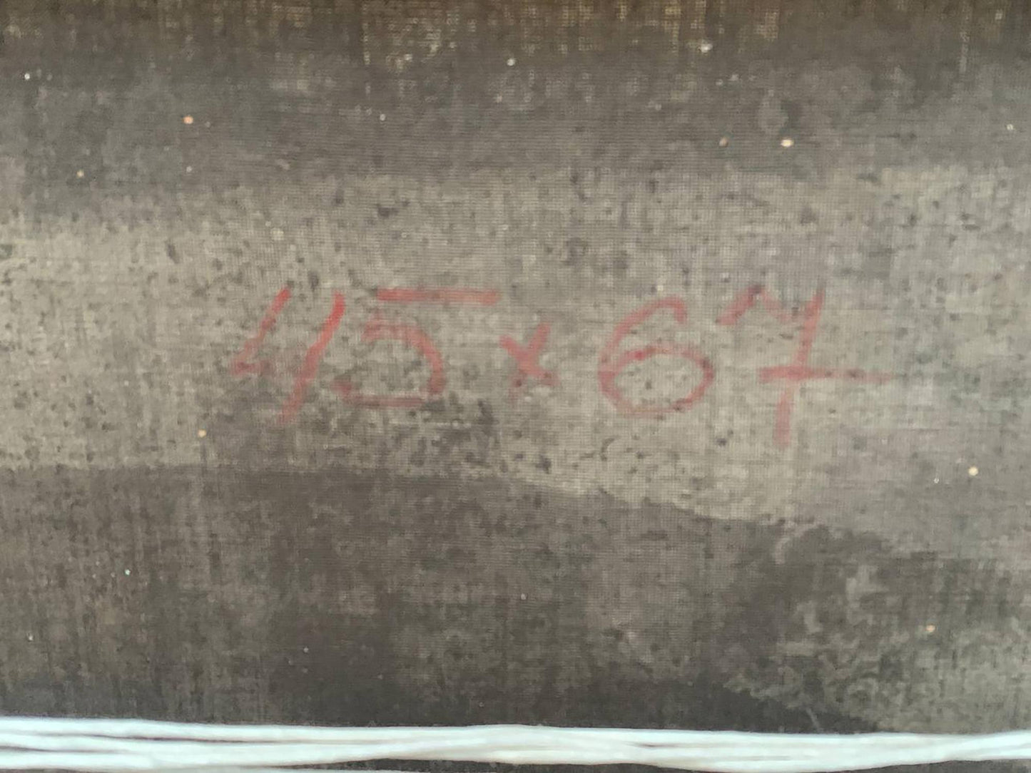 Back of Oil painting By the river Voronkov with red 45x67 markings on dark textured surface
