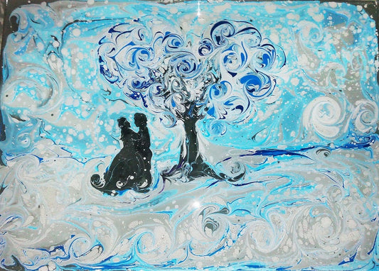 Ebru marbled artwork: black silhouettes of two figures under ornate tree