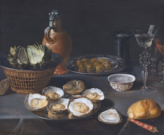 Silver serving tray with open oysters revealing creamy interiors in art and cooking