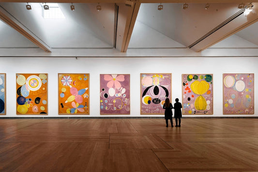 Vibrant abstract paintings with bold circular floral motifs in warm hues from Reflection of the Age