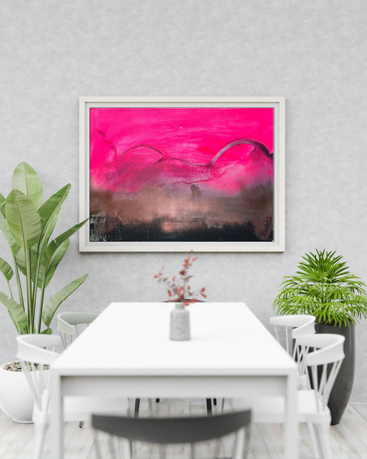 Vibrant pink black abstract painting in white frame above dining table