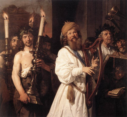 Man in white robe with blue sash holding reddish-brown harp, symbol of harmony