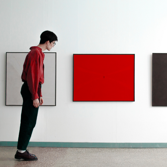 Bold red minimalist abstract art in thin black frame, evoking emotions.