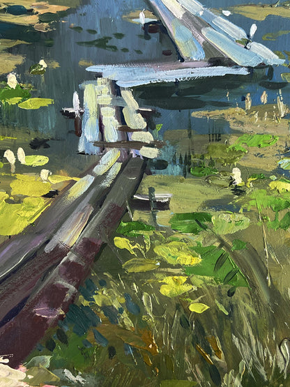 Impressionistic oil painting by Yuriy Suprunchuk of wooden bridge over river with boats
