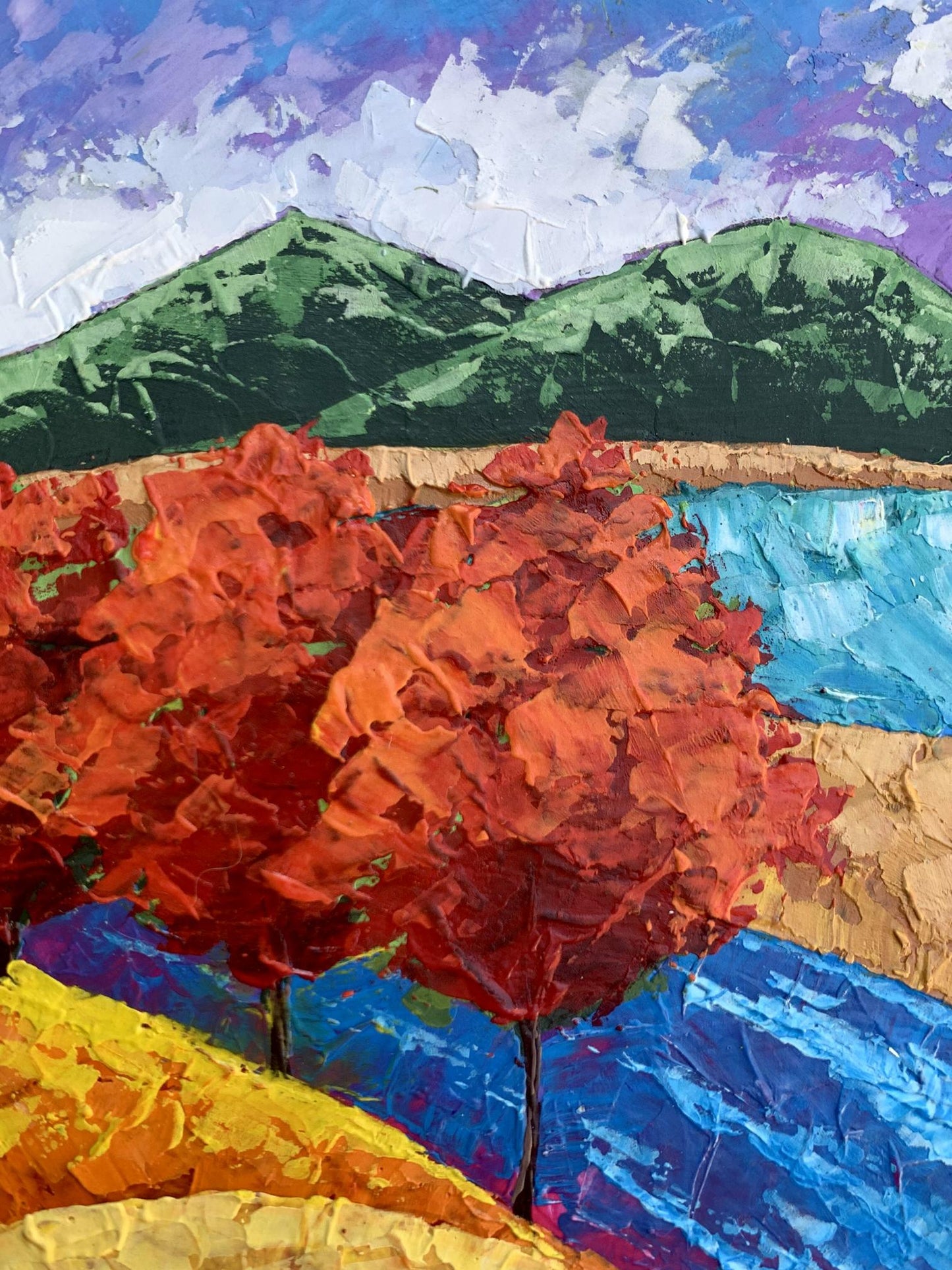 Oil painting of vibrant orange-red trees and mountains by V. Zadorozhnya