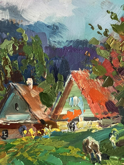Vibrant impressionist oil painting by Yuriy Suprunchuk of cows grazing in rustic village