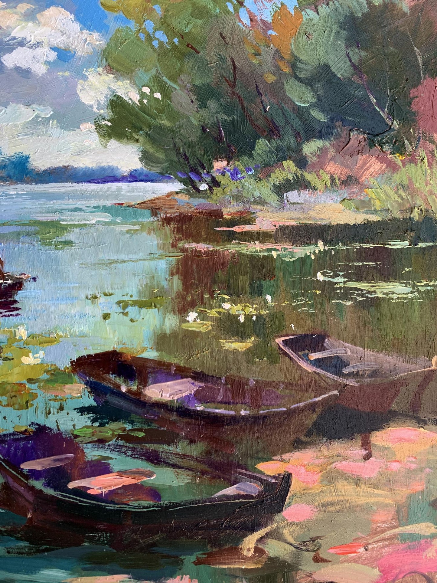 Vibrant impressionist oil painting by Yuriy Suprunchuk of rowboats on lily-pad lake