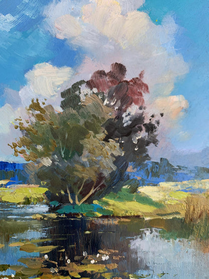 Vibrant impressionist oil painting by Yuriy Suprunchuk of lush tree by water