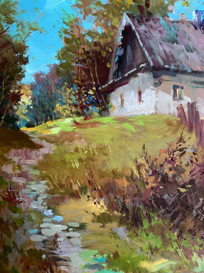 Oil painting of rustic white cottage by Yuriy Suprunchuk among autumn trees
