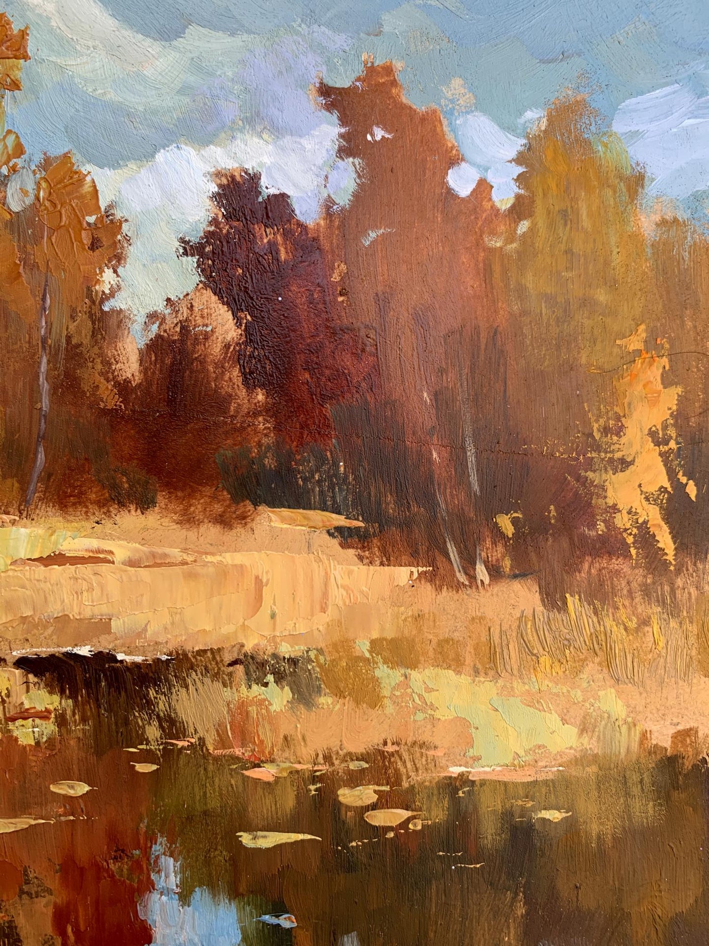 Golden autumn oil painting by Yuriy Suprunchuk with trees reflected in calm pond