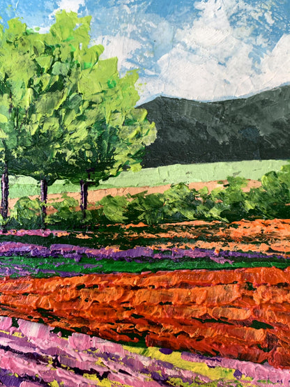 Vibrant impressionist oil painting of flower fields near mountains by V. Zadorozhnya