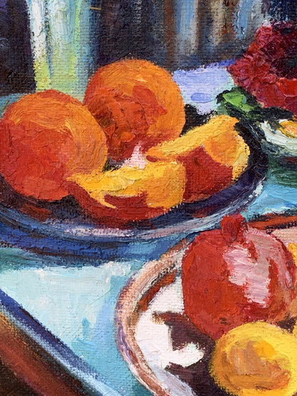 Oil painting by Boris Serdyuk: vibrant orange peaches and red pomegranate on ceramic plates