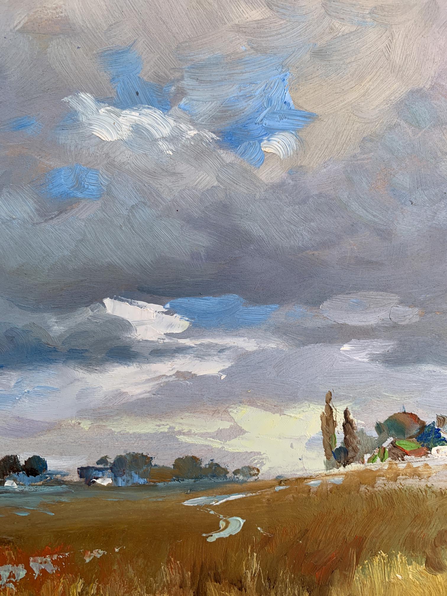 Oil painting Not far from the village by Yuriy Suprunchuk, dramatic sky over golden field