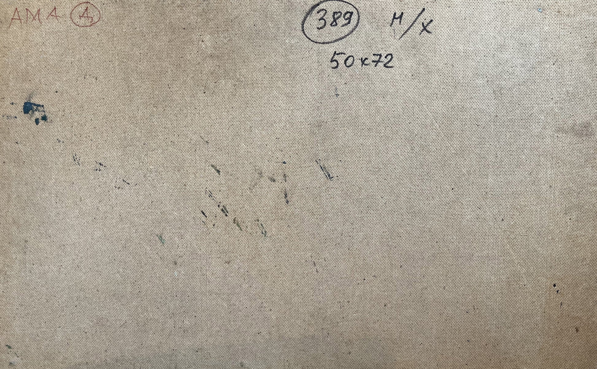 Back of beige canvas oil painting overlay with handwritten markings and stains