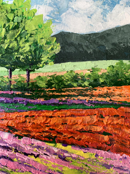Vibrant oil painting of flower fields near mountains by V. Zadorozhnya