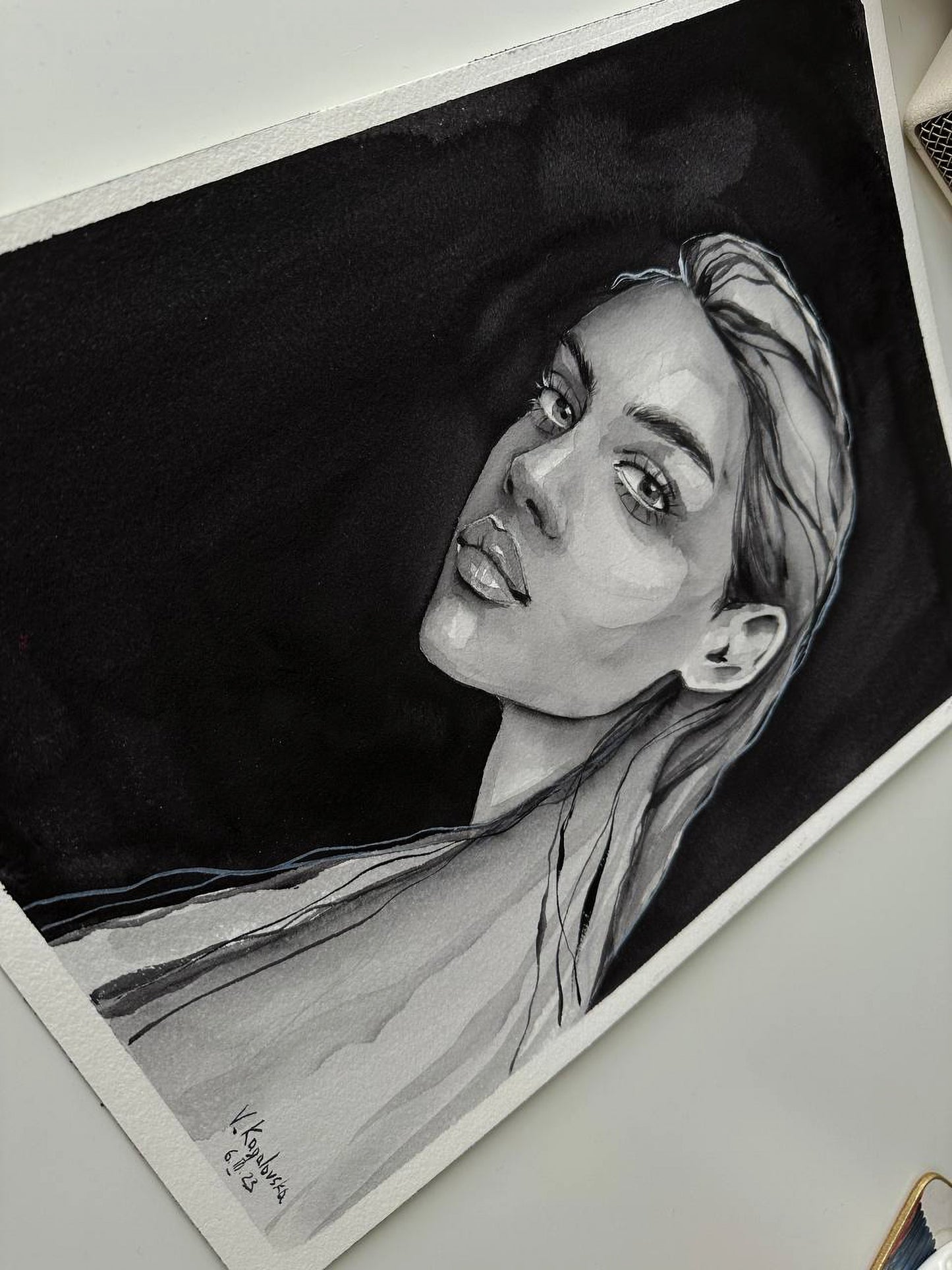 Detailed black-and-white charcoal portrait of woman by Victoria Kagalovska