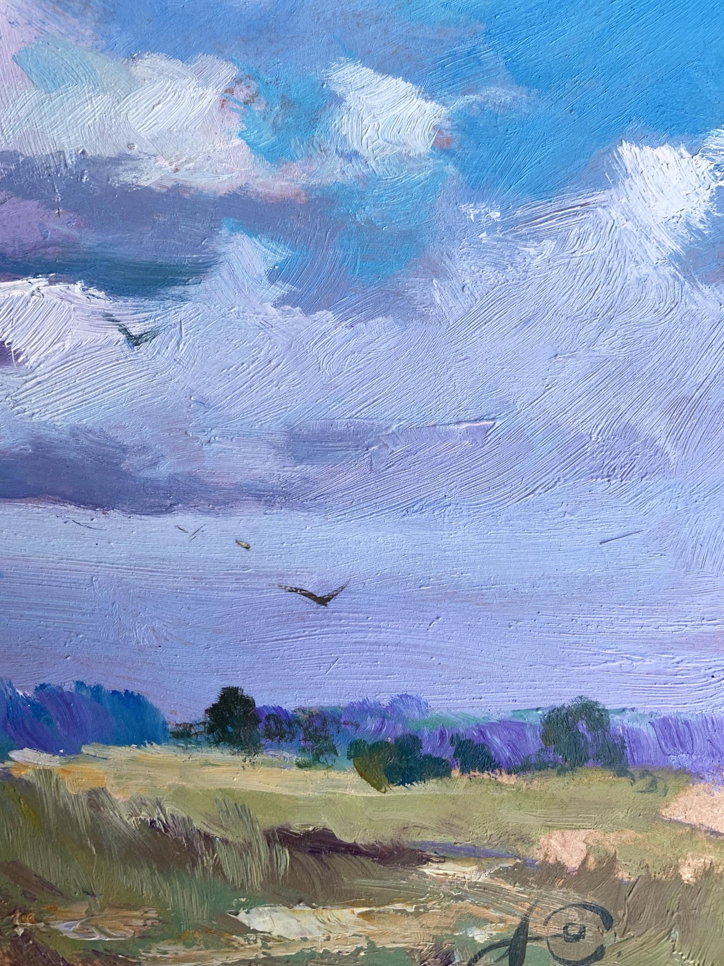 Oil painting In the village field by Yuriy Suprunchuk with swirling clouds