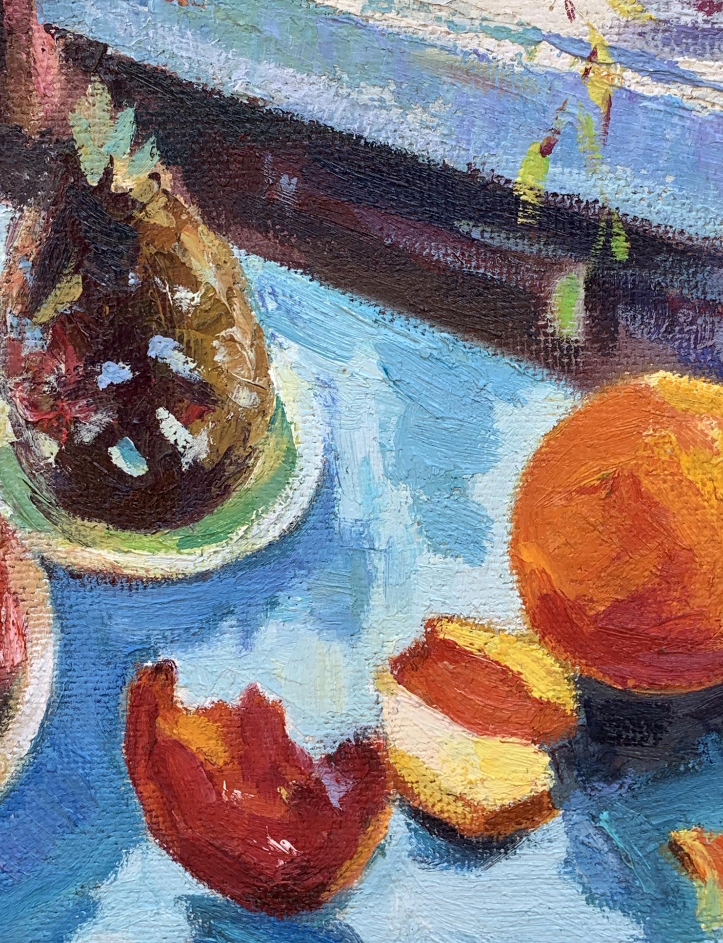 Oil painting by Boris Serdyuk: vibrant orange fruit and half on blue surface