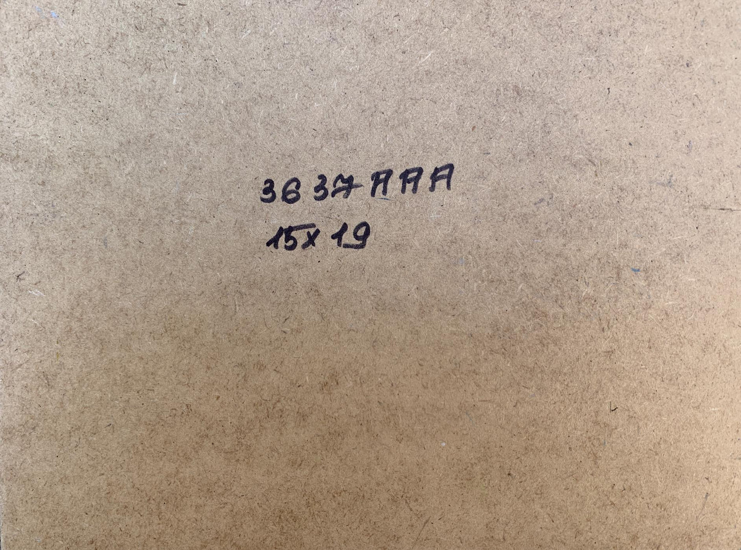 Back of Yuriy Suprunchuk oil painting on brown cardboard with black ink markings