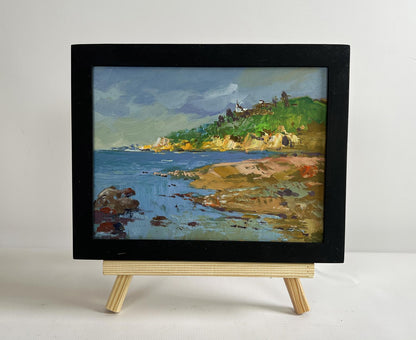Black-framed oil painting Silence at the foot of the mountains by Yuriy Suprunchuk