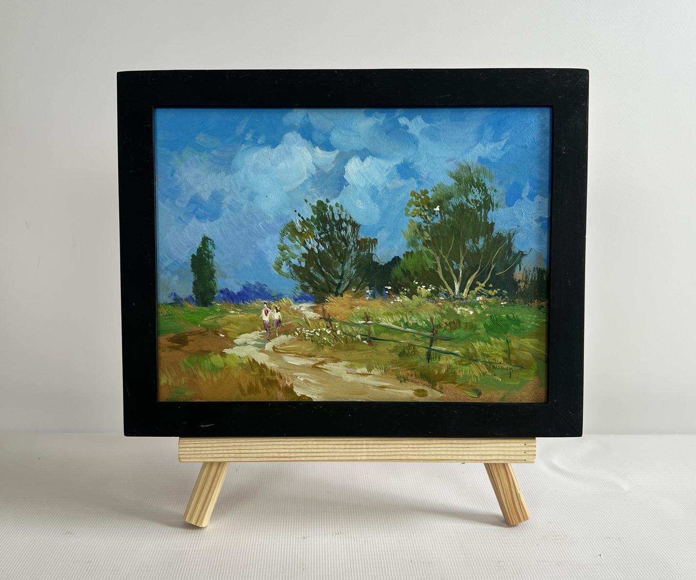 Oil painting Steps among the greenery by Yuriy Suprunchuk in black frame on easel