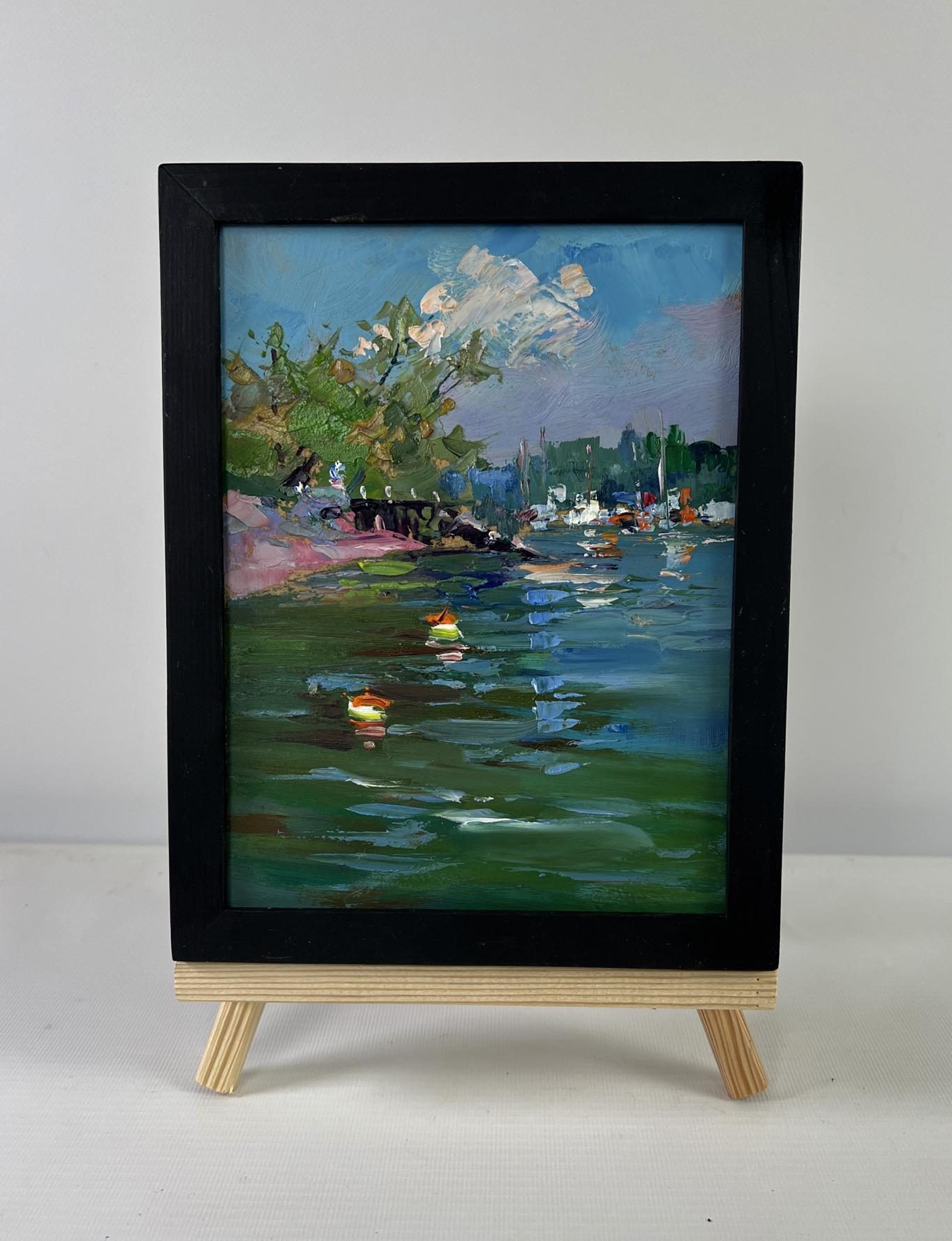 Black-framed impressionistic oil painting of summer city river by Yuriy Suprunchuk