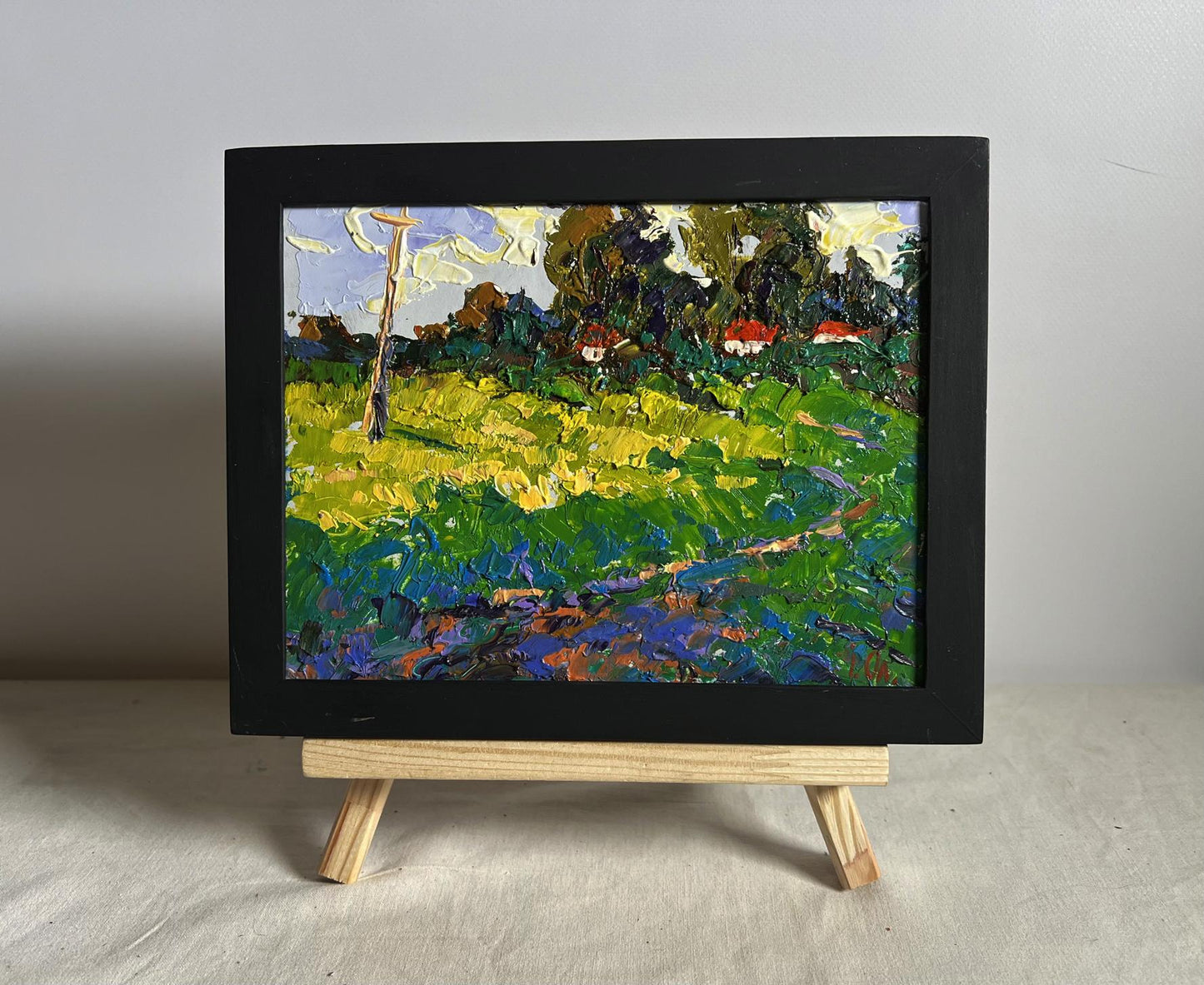 Oil painting Yellow fields near the village by Oleksiy Ivanyuk in black frame