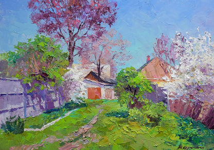 Oil painting Flowering garden by Boris Serdyuk: stone cottage with orange door among blooming trees