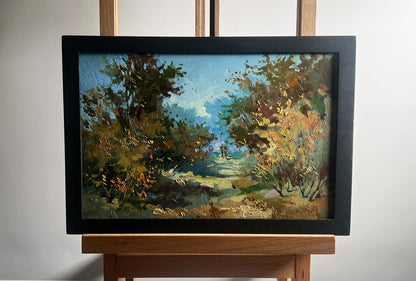 Oil painting Walking in the autumn forest by Yuriy Suprunchuk in black frame