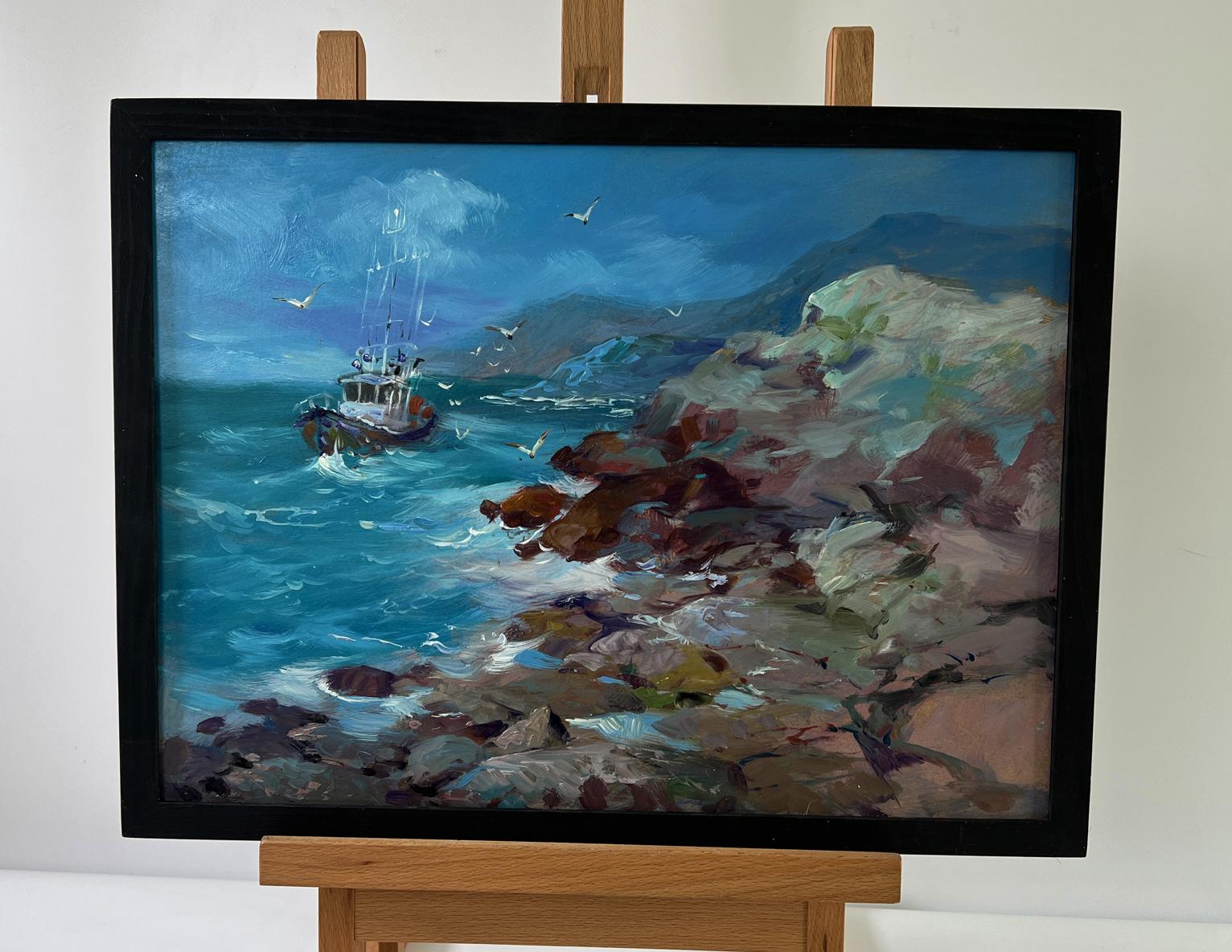 Oil painting of boat on rocky seashore by Yuriy Suprunchuk in black frame