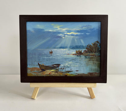 Oil painting Rays of sun through clouds by Yuriy Suprunchuk lakeside scene