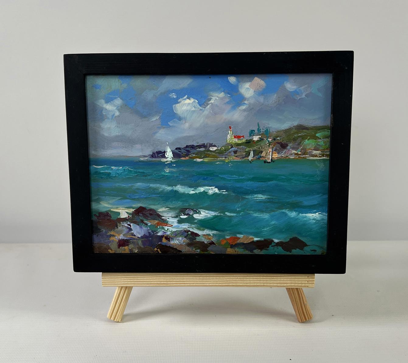 Black-framed miniature oil painting by Yuri Suprunchuk of sailboats, turquoise waves, lighthouse on rocky shore