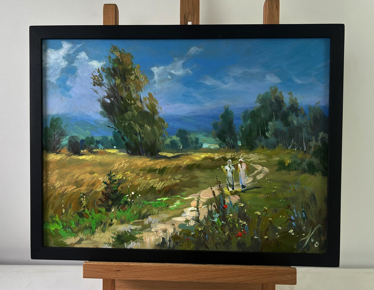 Framed oil painting of light breeze on flower field by Yuriy Suprunchuk