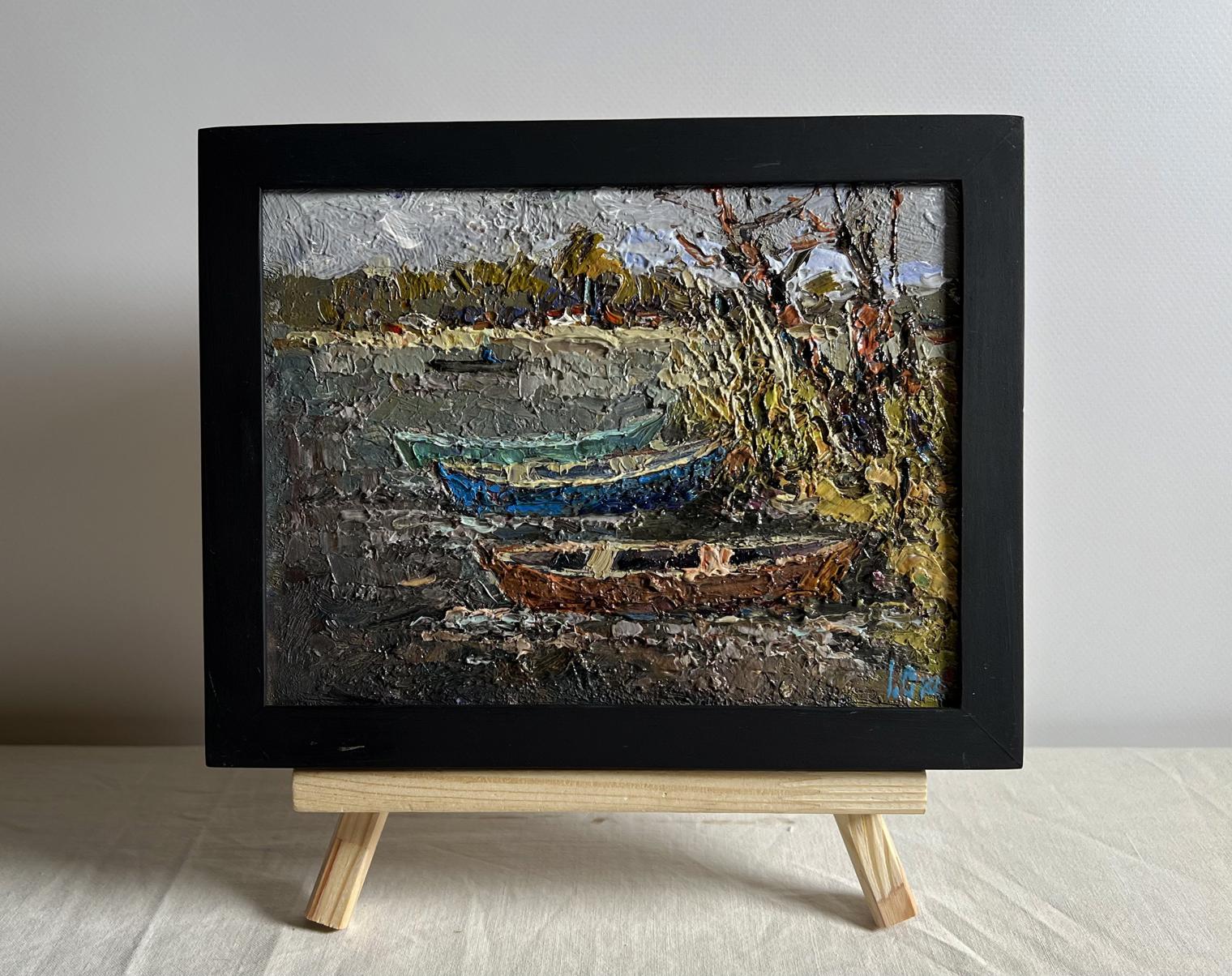 Oil painting Autumn melancholy by Oksana Ivanyuk, textured boats on shoreline in black frame