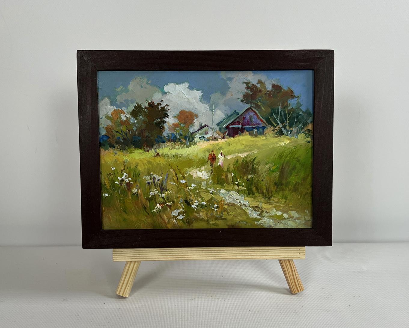 Framed oil painting by Yuriy Suprunchuk of couple in pastoral field