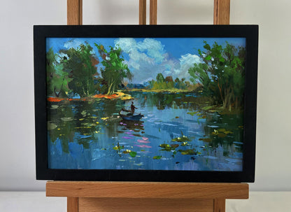 Framed oil painting of serene river with boat by Yuriy Suprunchuk