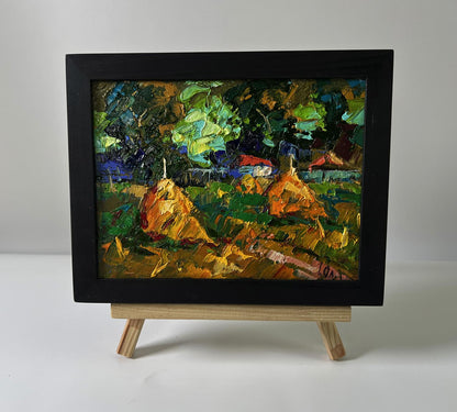 Oil painting Summer evening in the village by Oleksiy Ivanyuk in black frame