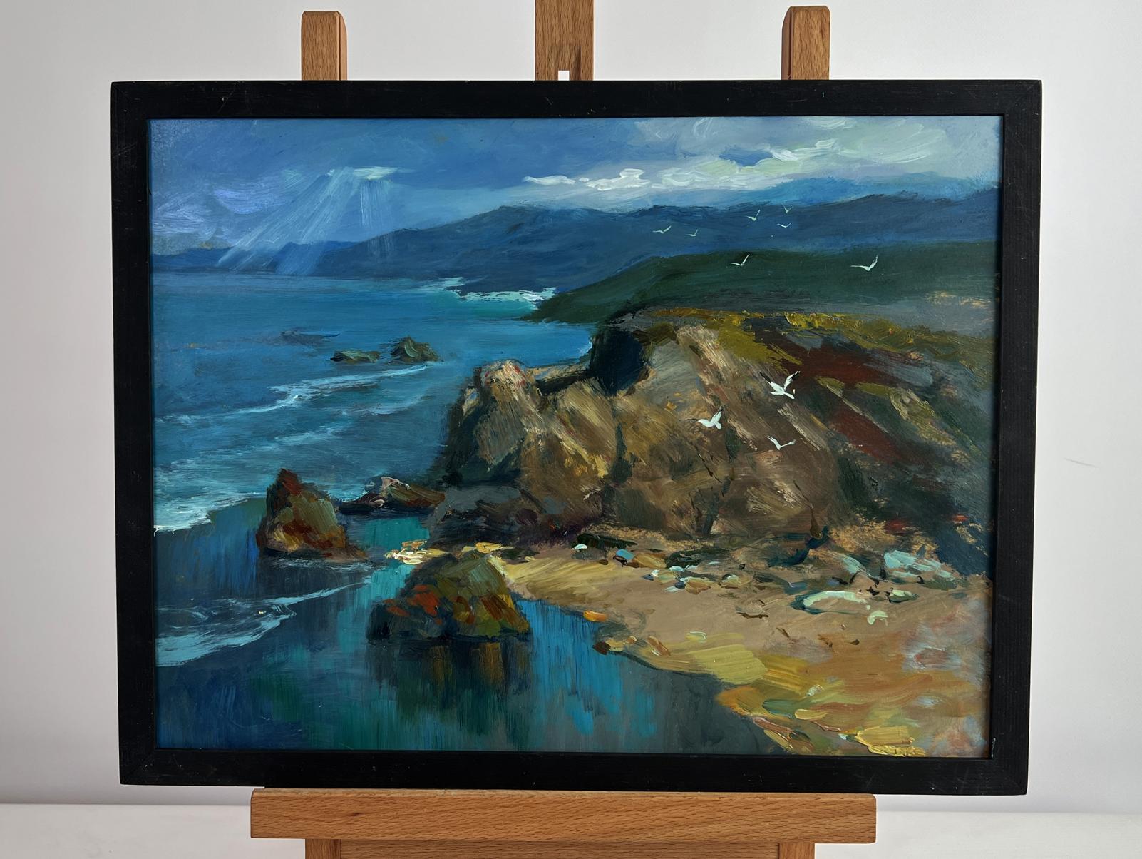 Framed oil painting of coastal cliffs, waves, seagulls and sunlight through clouds by Yuriy Suprunchuk