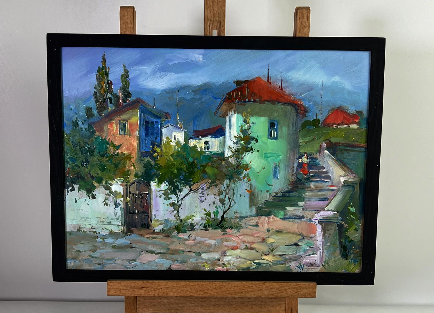 Framed oil painting of colorful city street stairs by Yuriy Suprunchuk