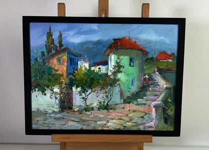 Framed oil painting of colorful city street stairs by Yuriy Suprunchuk