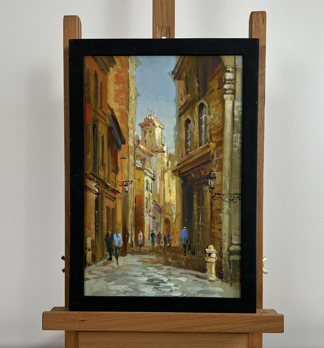 Framed oil painting of sunlit European street by Yuriy Suprunchuk