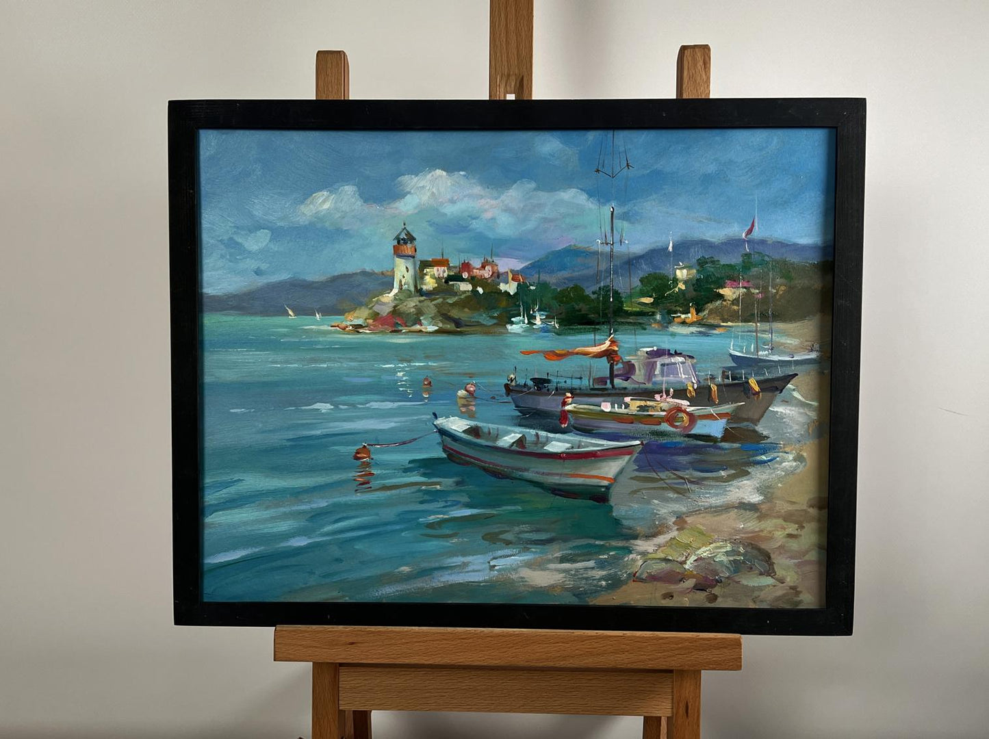 Framed oil painting of boats and lighthouse by Yuriy Suprunchuk