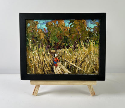 Oil painting Where the Reeds Whisper by Oleksiy Ivanyuk on wooden easel