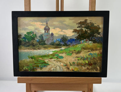 Framed oil painting of church over river by Yuriy Suprunchuk