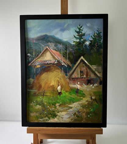Framed oil painting of rustic houses on mountains by Yuriy Suprunchuk
