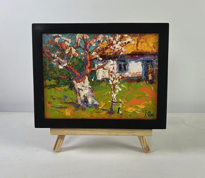 Oil painting Quiet Comfort Beneath the Spreading Tree by Oksana Ivanyuk in black frame